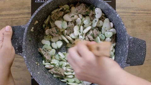 Making bean stew cooked with beef, Lebanese cuisine. Time lapse Stock Footage 122450997