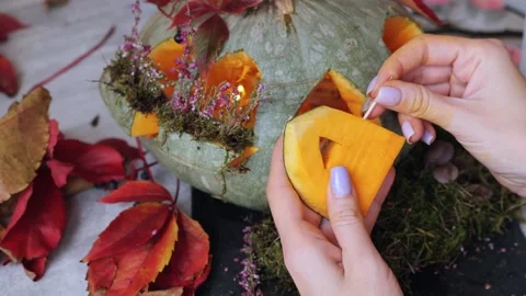 Making beautiful autumn lantern from pumpkin, put door using toothpicks Video stock 250779549