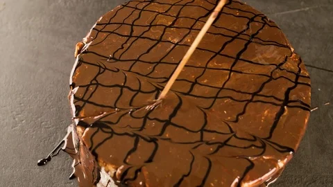 Making beautiful Pattern on chocolate Cake with wooden stick Stock Footage 102621317