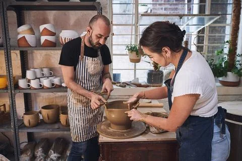 Making beautiful things makes life better. a young man and woman working with Stock Photos