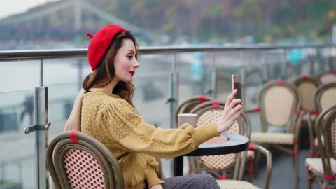 Making beauty selfie using camera on smartphone french young woman in red beret Video stock 147119327