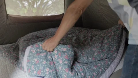 Making a Bed Inside a Camping Tent Stock Footage 346533857