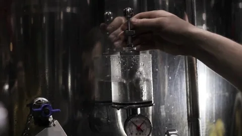 Making beer in the beer factory. Checking the pressure, boiling with water Stock Footage 85361965