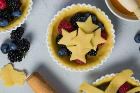 Making berry pie Stock Photos