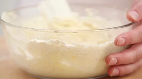 Making biscuit dough: folding in beaten egg white Stock Footage 24663433