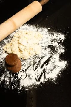 Making biscuits with rolling pin and dough Stock Photos