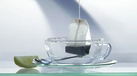 Making black tea: pouring hot water onto tea bag Stock Footage 8570540