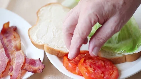 Making a BLT sandwich Stock Footage 88711254