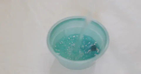 Making blue easter egg dye Stock Footage 239578137