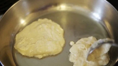 Making blueberry pancakes Stock Footage 102750609