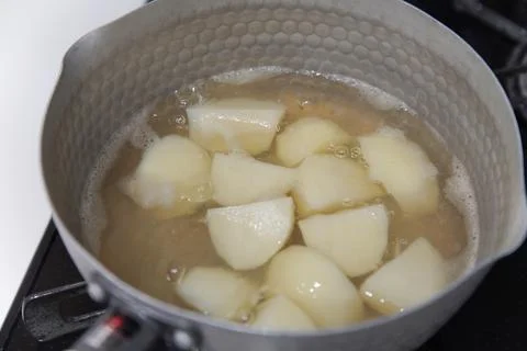 Making boiled potatoes Stock Photos