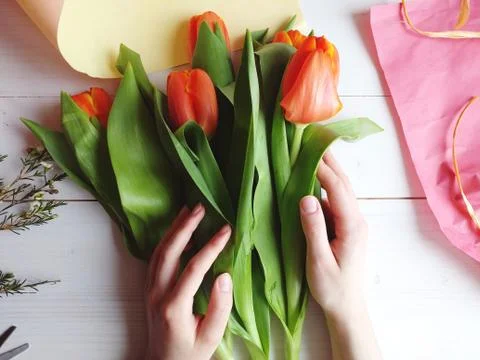 Making bouquet of tulips. Small business. Stock Photos