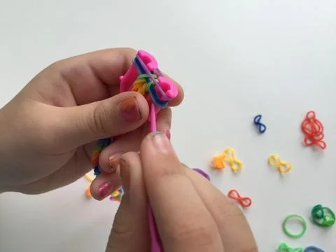 The making bracelets from rubber bands Stock Photos