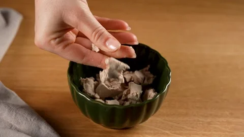 Making Bread - Crushing fresh yeast in small pieces in slow motion 4K Stock Footage 265886741
