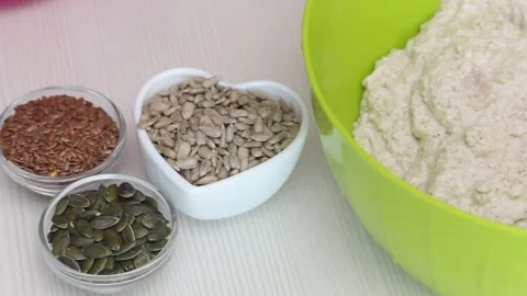 Making bread from green buckwheat. Containers contain flax, pumpkin and sunfl Stock Footage 162170504