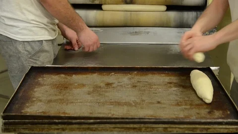 Making bread. Men manually kneading fresh dough. Baker hands kneading dough Stock Footage 125716228