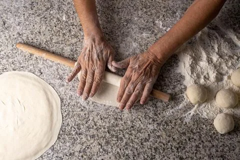 Making bread with a rolling pin, yeast dough, Turkish style Stock Photos