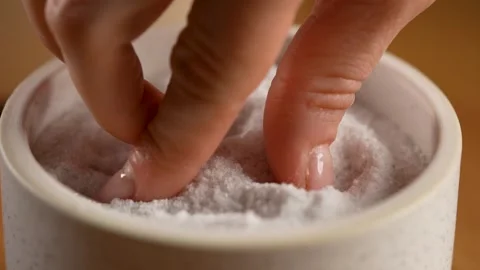 Making Bread - taking coarse salt from a container in slow motion - macro 4K Stock Footage 265887673