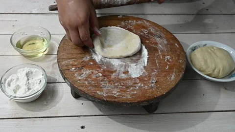 Making breads, biscuits, cakes. or pide dough by close up female hands in pa Stock Footage 209134233