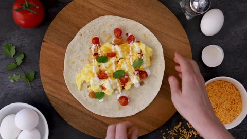 Making a Breakfast Burrito Stock Footage 171871551