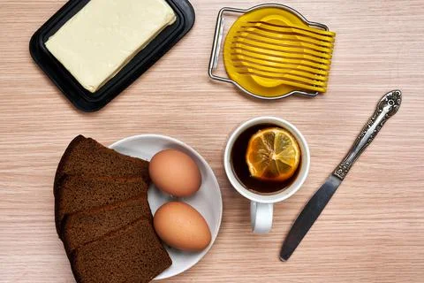 Making a breakfast sandwich, bread and butter and egg with egg cutting Stock-Fotos