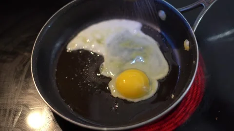 Making breakfast sandwich, cooking eggs, ham and egg sandwich, morning Stock Footage 262562566