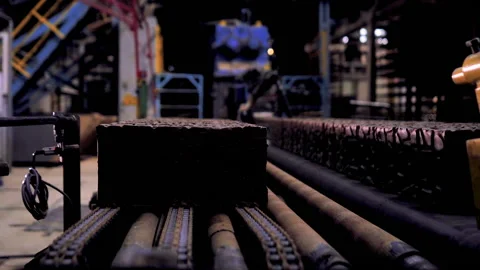 Making bricks on a conveyor belt Stock Footage 132776409