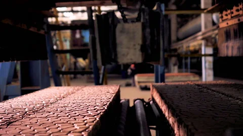 Making bricks on a conveyor belt Stock Footage 132776622