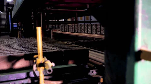 Making bricks on a conveyor belt Stock Footage 132776637