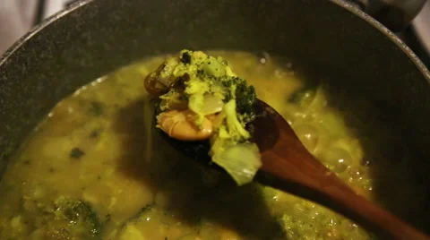 Making of broccoli soup, beans and onions, on the stove Stock-Footage 57844676