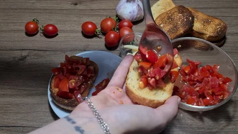Making Bruschetta With Cherry Tomatoes And Garlic Vídeo Stock 160675250