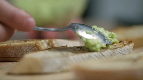Making bruschettas, mashed with avocado on toasted bread Stock Footage 162459007