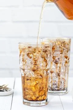 Making bubble tea, pouring blend milk tea into brown sugar pattern drinking g Stock Photos
