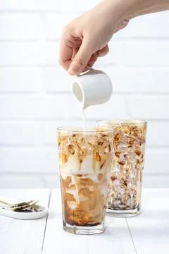 Making bubble tea, pouring blend milk tea into brown sugar pattern drinking g Stock Photos