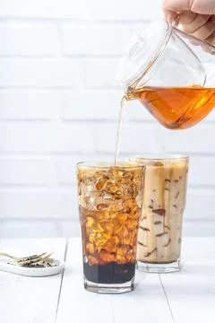 Making bubble tea, pouring blend milk tea into brown sugar pattern drinking g Stock Photos