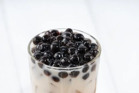 Making bubble tea, pouring blend milk tea into brown sugar pattern drinking g Stock Photos