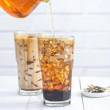 Making bubble tea, pouring blend milk tea into brown sugar pattern drinking g Stock Photos