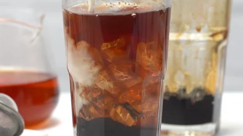 Making bubble tea, pouring milk into brown sugar glass cup Stock Footage 137213630