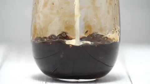 Making bubble tea, pouring milk into brown sugar glass cup Stock Footage 137213648