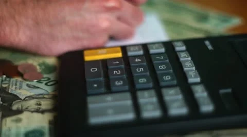 Making A Budget With Calculator Stock Footage