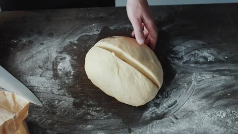 Making Burger Bread by Cutting Dough with a Large Kitchen Knife on Wood 库存影片 331100840