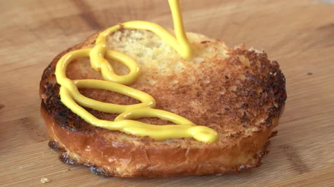 Making burger close-up, the hand of a chef in black gloves prepares a burger or Stock Footage 179322423