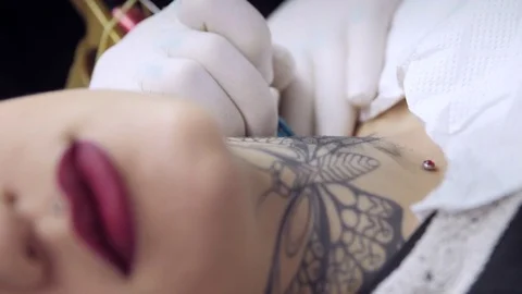 Making a butterfly tattoo - Rack focus Stock Footage 83278870