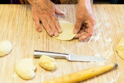 Making cabbage pies of dough 스톡 사진