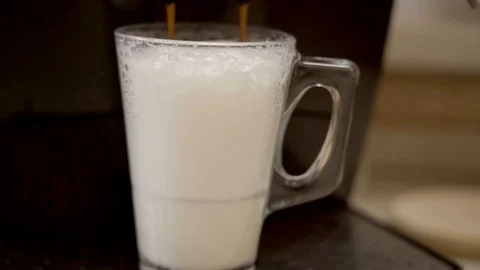 Making a caffe latte coffee. Stock Footage 95001332
