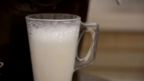 Making a caffe latte coffee. Stock Footage 95002131