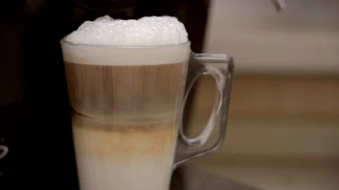 Making a caffe latte coffee. Stock Footage 95002169