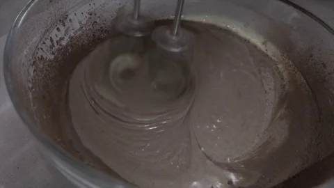Making cake and stir of chocolate with mixer whipper Vídeo Stock 83882065