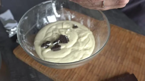 Making cake batter. Dough with cookie pieces. Stock Footage 341658823