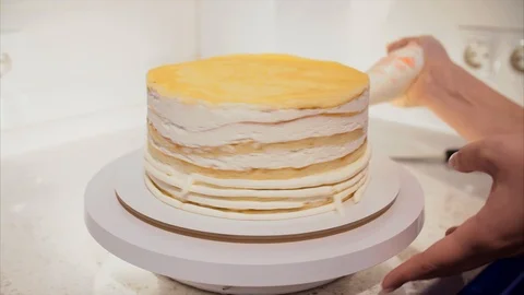 Making Cake Coating Cream on Biscuit Stock Footage 106984342